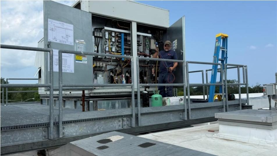 Electricians working on life-safety and electrical systems