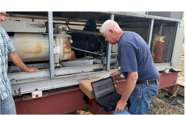 Engineer assessing mechanical plant equipment